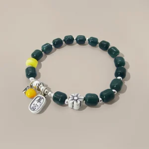 Armband-gruen-mit-anhaenger Armband Jade Dunkelblau mit Silber und Wachsbernstein