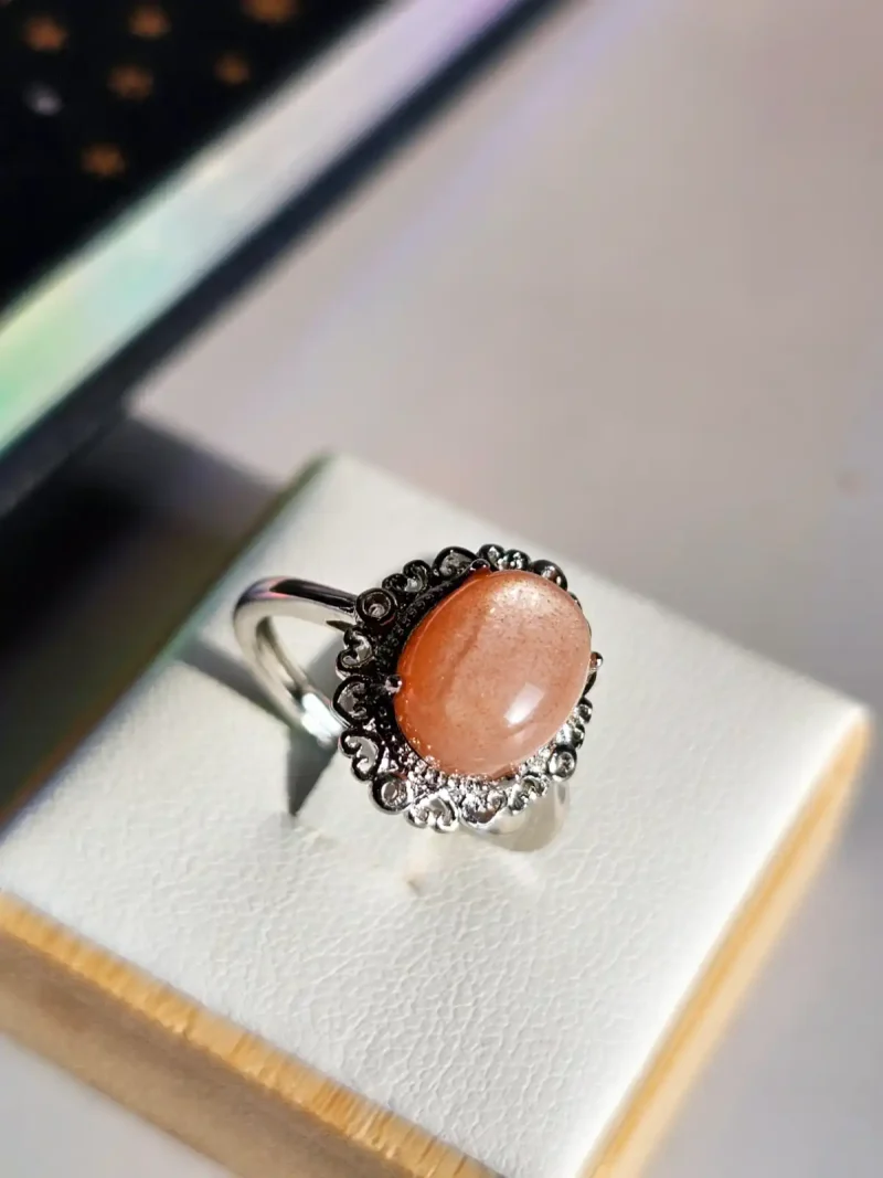 DR-TDS-09-04 versilberter Ring mit orangefarbenem Mondstein Blumen Halterung