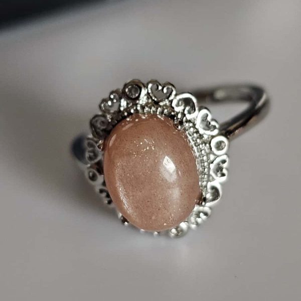 versilberter Ring mit orangefarbenem Mondstein Blumen