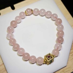 Damenarmband mit Rosenquarz Naturstein und vergoldetem Schmuckelement