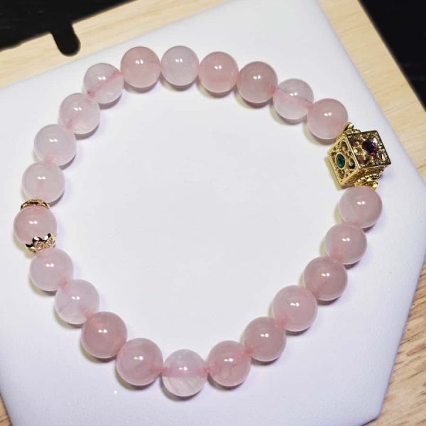 Damenarmband mit Rosenquarz Naturstein und vergoldetem Schmuckelement