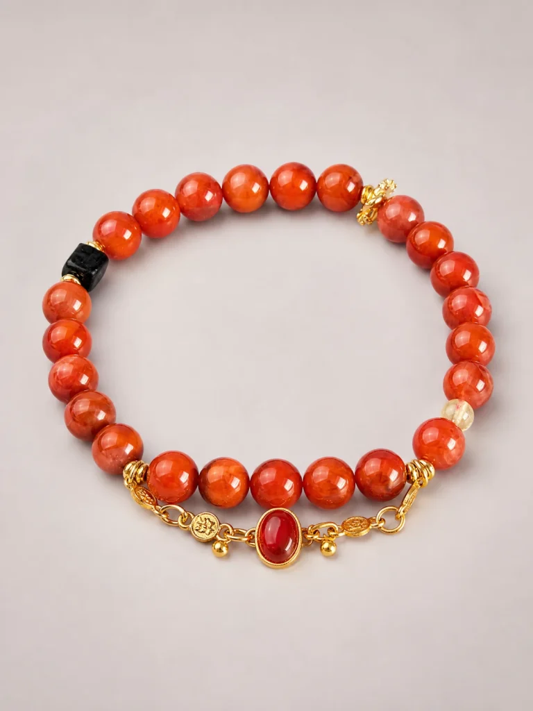 Nanhong Achat Armband mit Agarholz und vergoldeten Details