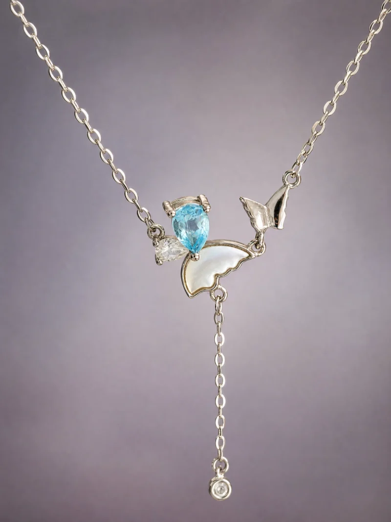 S925 Silber Y-Halskette mit natürlichem blauem Topas und Zirkonia vor einem grauer Hintergrund, Kette 40+5 cm